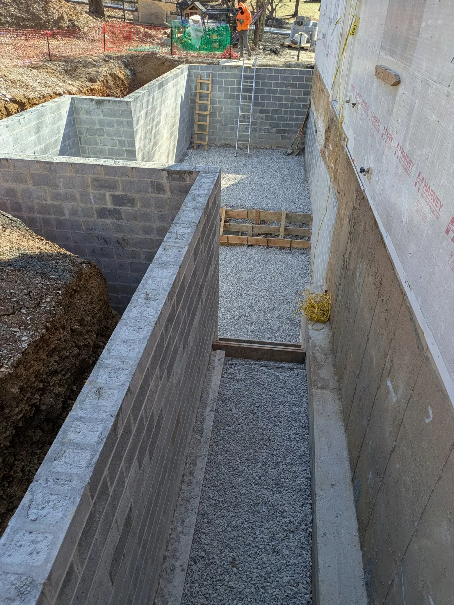 Long block foundation wall with gravel base
