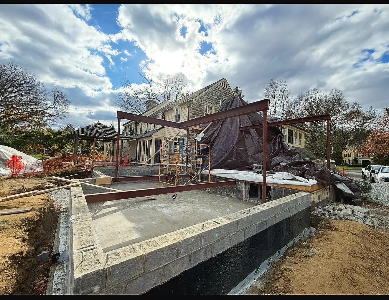 Poured foundation walls with steel beams set for a home addition